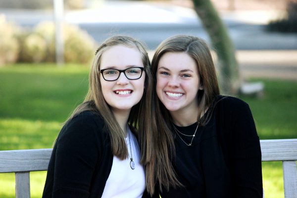 Two teen girls smile